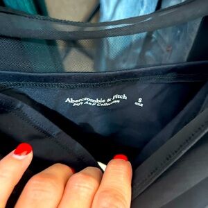 Mesh top with tank underneath.